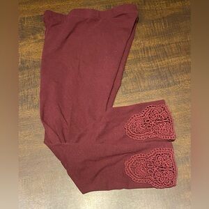 Maroon leggings with crochet accents